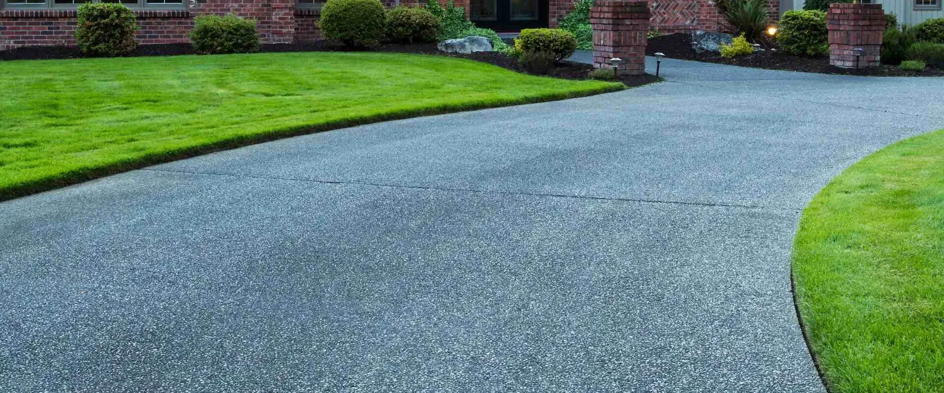 concrete driveway flatwork with green beautiful lawn and landscape montgomery al